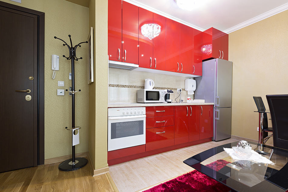 Red cabinets makes space bigger