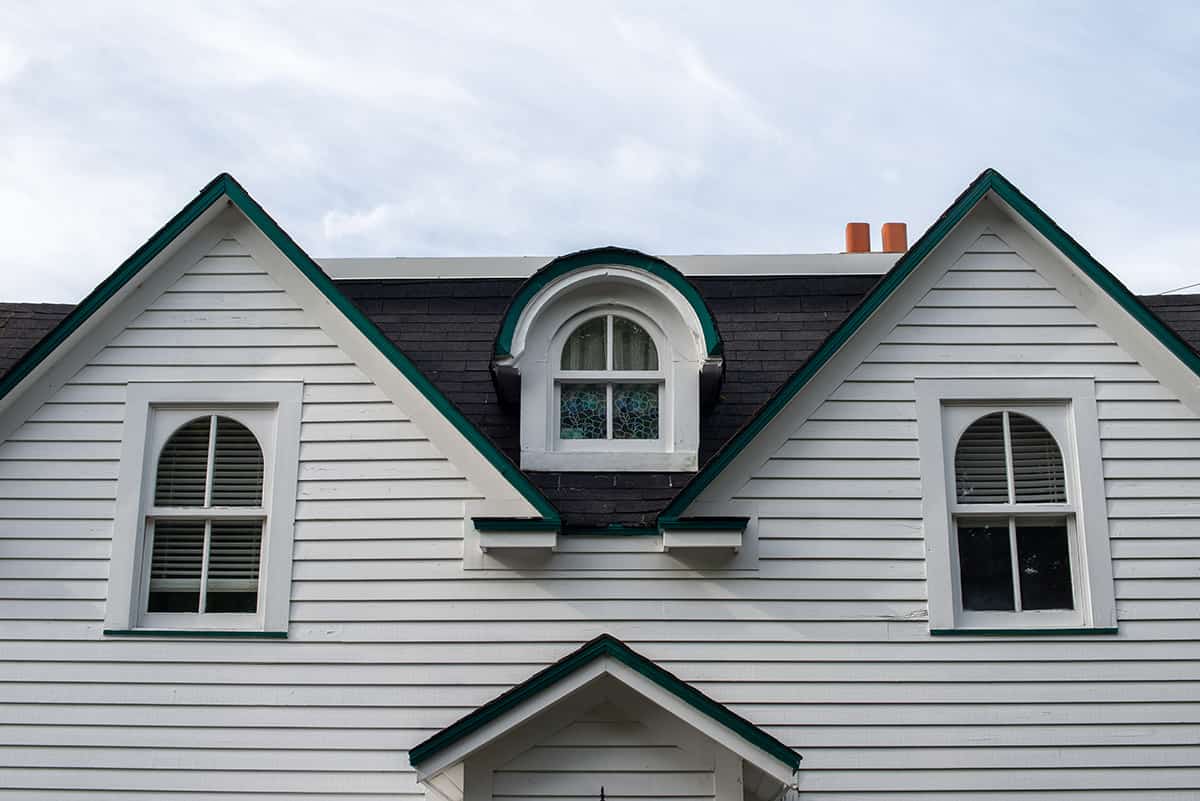 White Clapboard Siding with Black Shingles and Trim