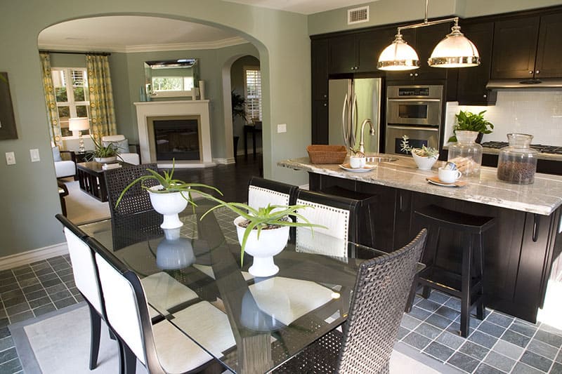 Island With Beaming Pendant Lights On A Spacing Saving Kitchen And Dining Room