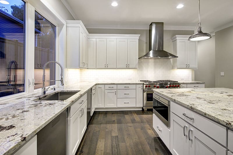 Large Island In A Spacious Kitchen Design With A Cool Blend Of Colors