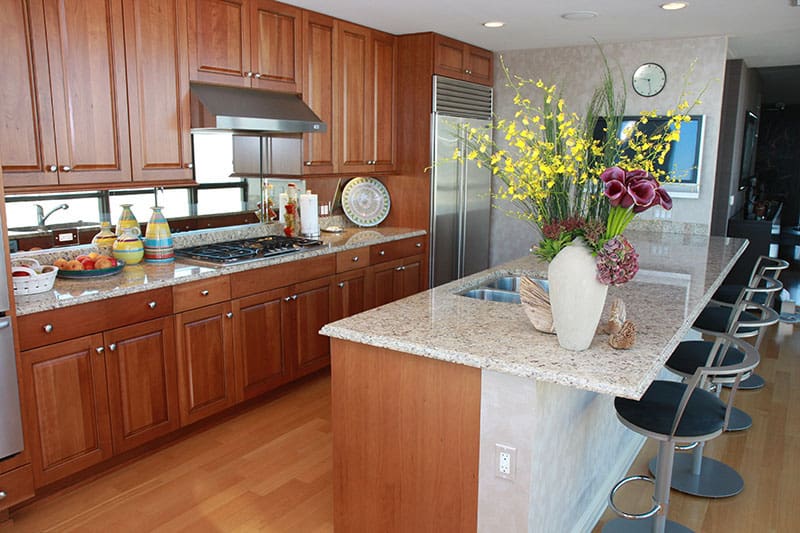 Modern Kitchen Island With Marble Countertop In A Penthouse Condo