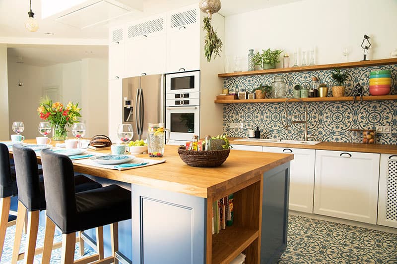 Wooden Island In A Mediterranean Style Kitchen With Open Space