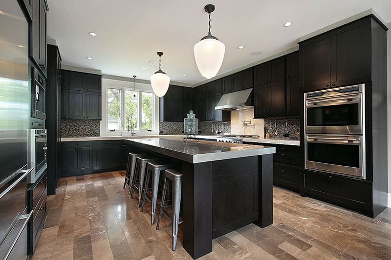 Dark Toned Wood As Kitchen Cabinetry And Island Creates A Modern Powerful And Vibrant Design