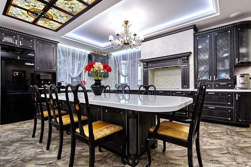 Elegant Chandelier Hanging Above The Kitchen Island