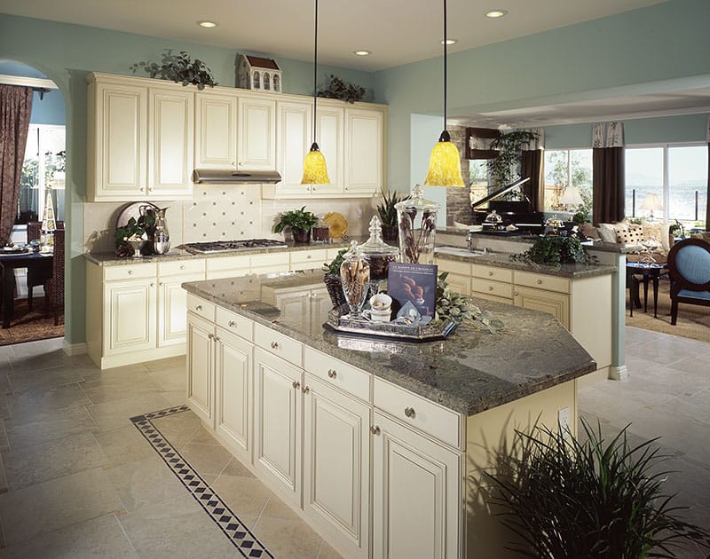 Large Island And Traditional Lightning In A Contemporary Kitchen