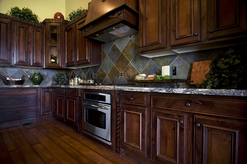 Dark Flooring And Cabinets With An Authentic Arrangement Of Kitchen