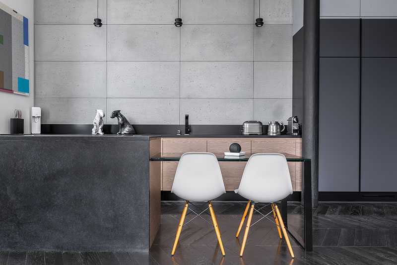 Black Hardwood Flooring Blends Perfectly With The Cabinets And Island Balanced By The Greyish Wall