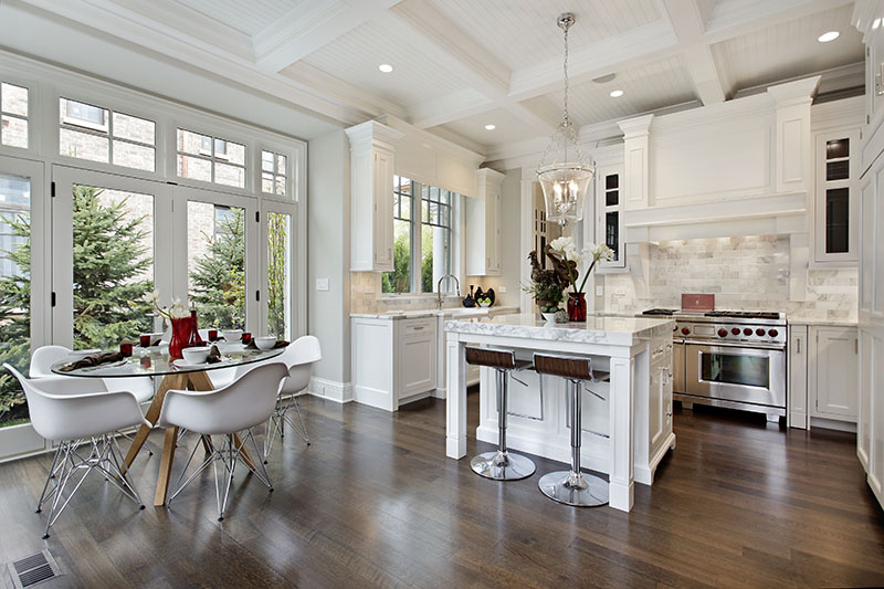 Bold Contrast Among Deep Brown Floor And Light Paint On The Walls Island And Ceiling