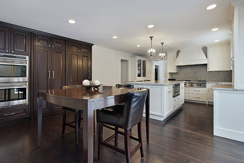 Deep Wooden Brown Floor Cabinets And Table Creates A Dynamic Contrast With The Kitchen Island