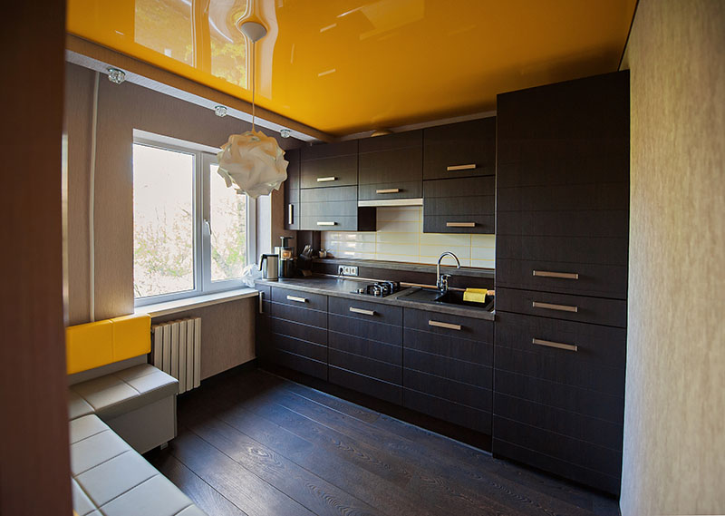 Kitchen Exudes Warmth Supported By A Dark Brown Floor That Matches The Kitchen Cabinets