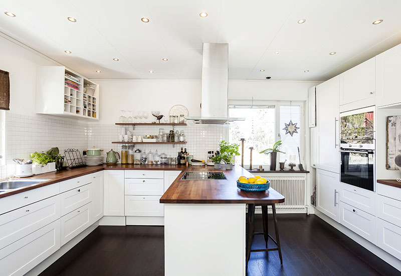 Rustic Wooden Counter, Polished Cabinetry And A Cool Ambiance