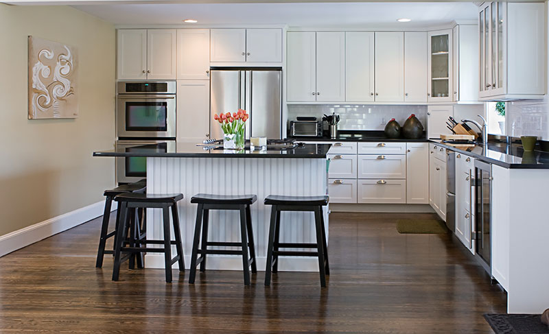 Smooth Dark Wood Floor Closes On The Beige Finished Wall