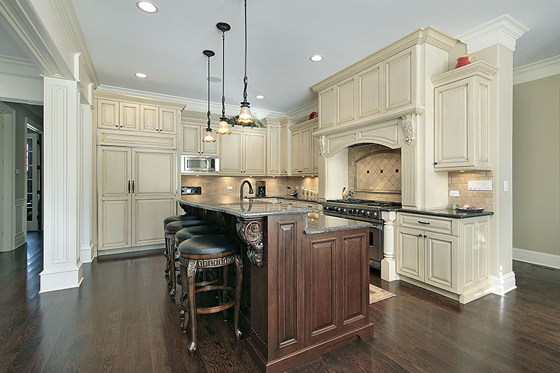 Traditional Look Of The Kitchen Magnified With The Rustic Wooden Island And Cabinet