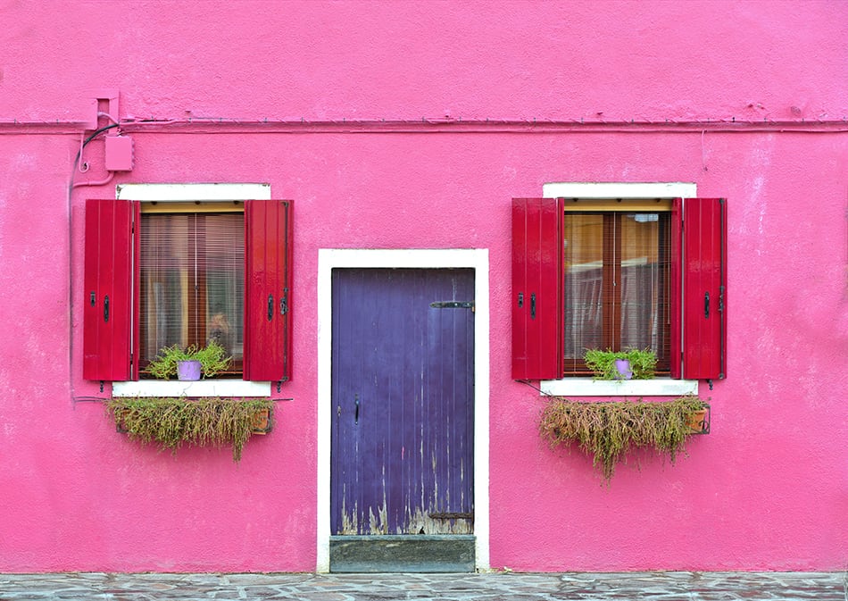 Rustic Wooden Purple Door with Red Shutters