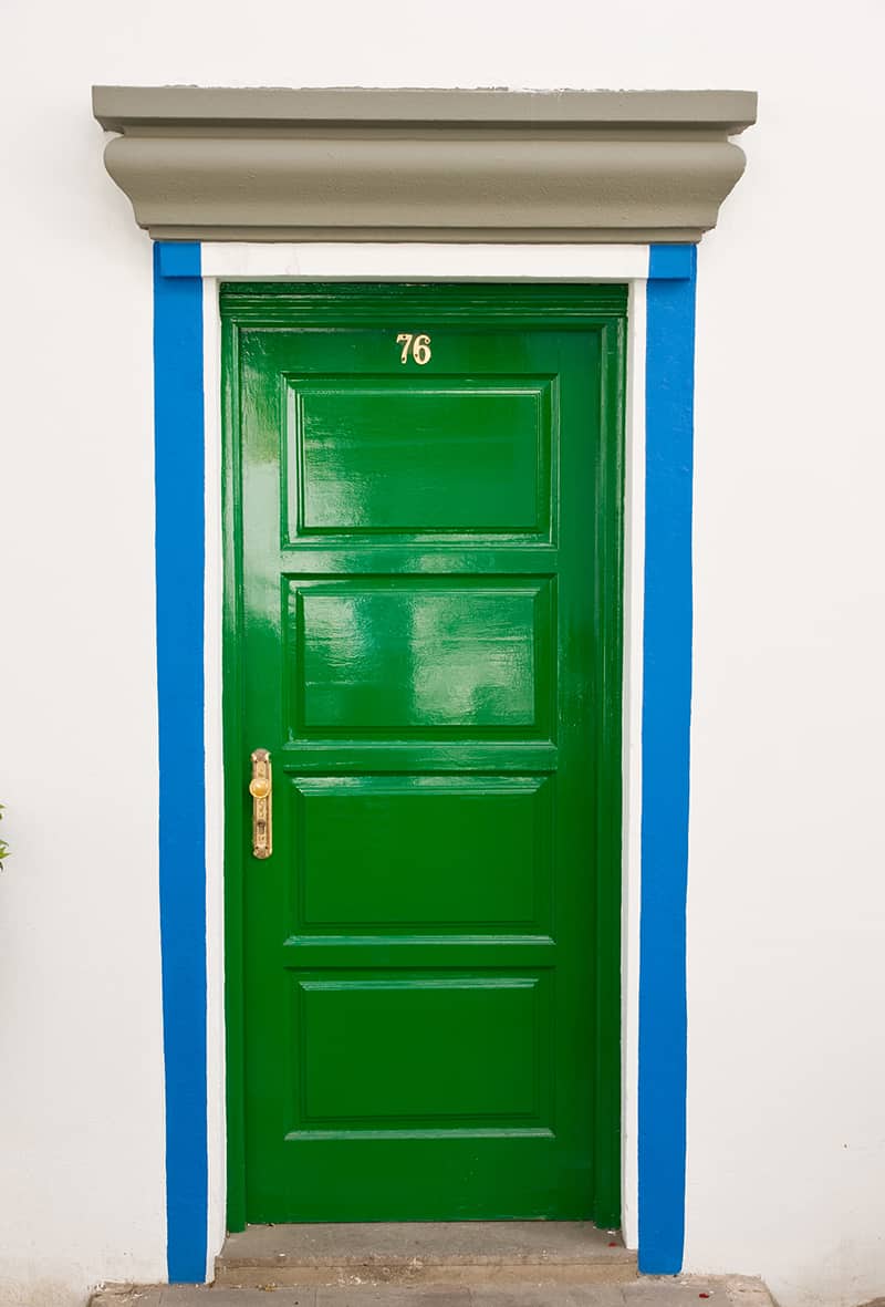 Green Door with Blue and Gray Siding