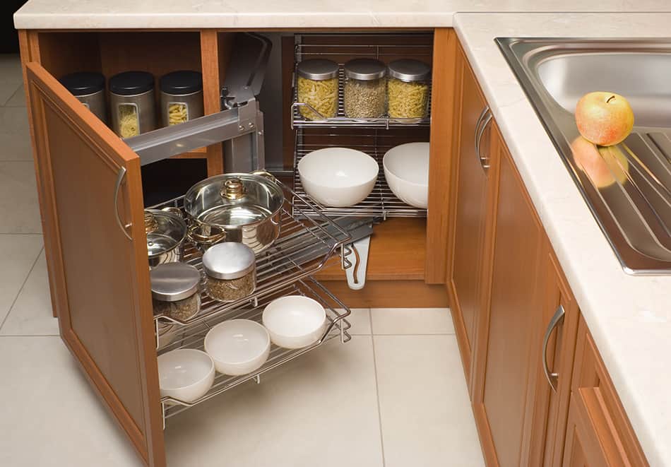 A metal organizer attached to the cabinet