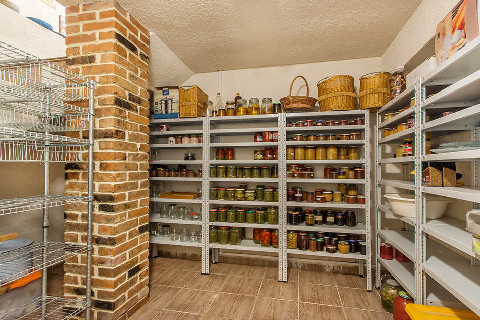 A pantry for storing various jars food