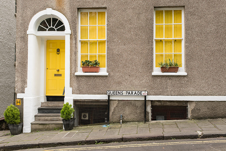 Green-Yellow Door on a Neutral Exterior