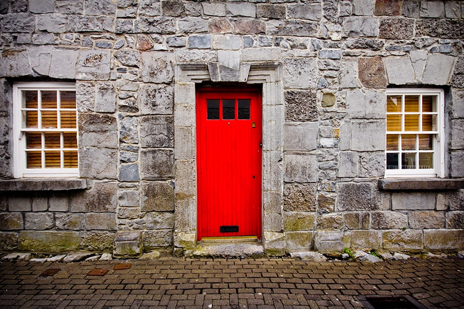 Red Door on Stone Exterior