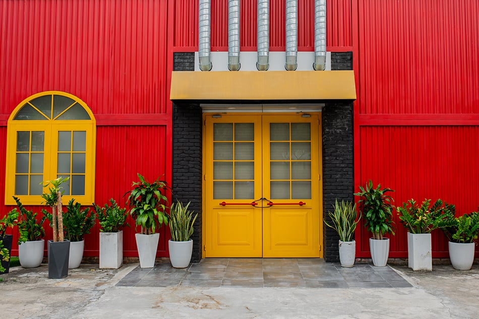 Yellow Double Doors with Bright Red Siding