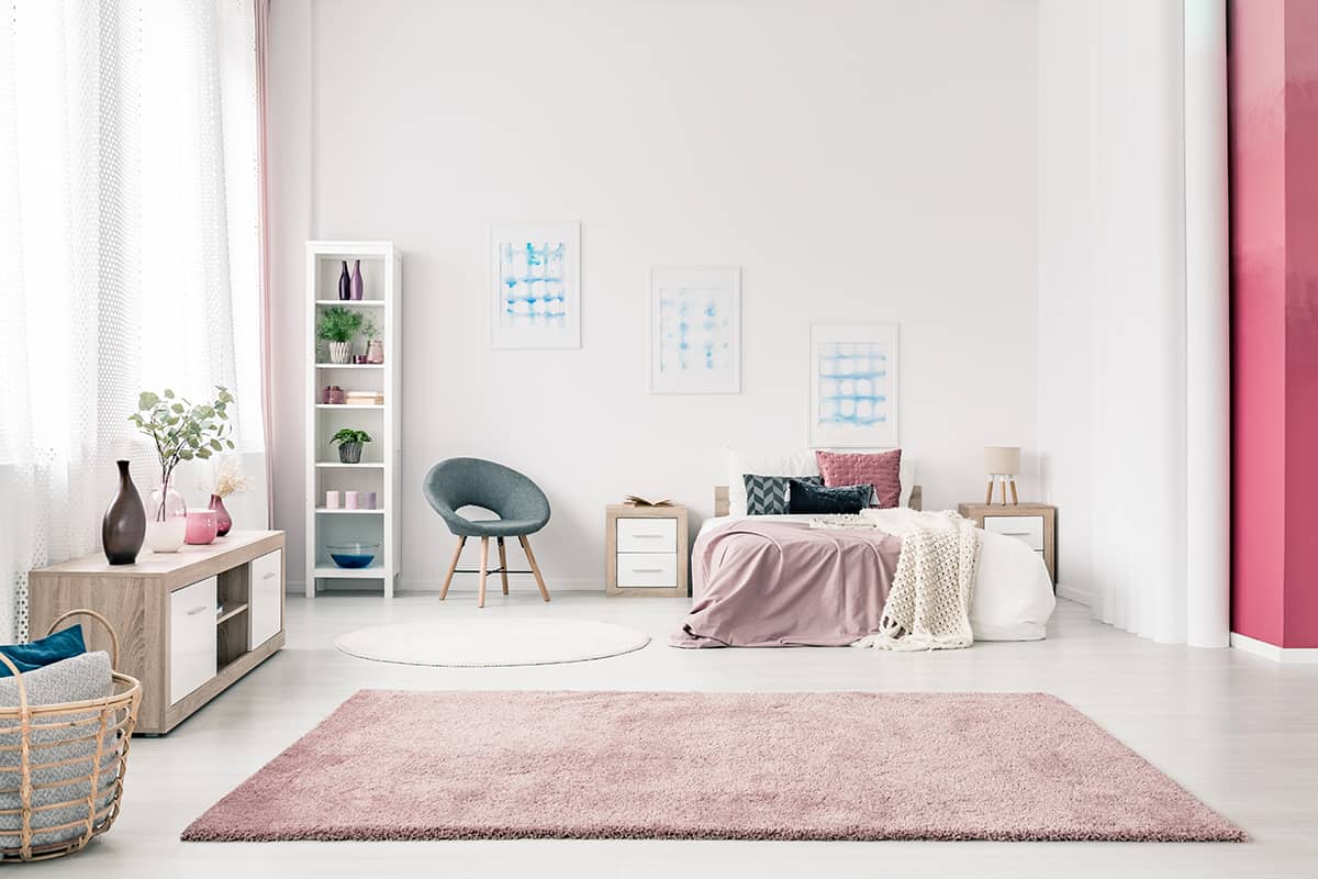 Pink Fluffy Rug with Brown Couch