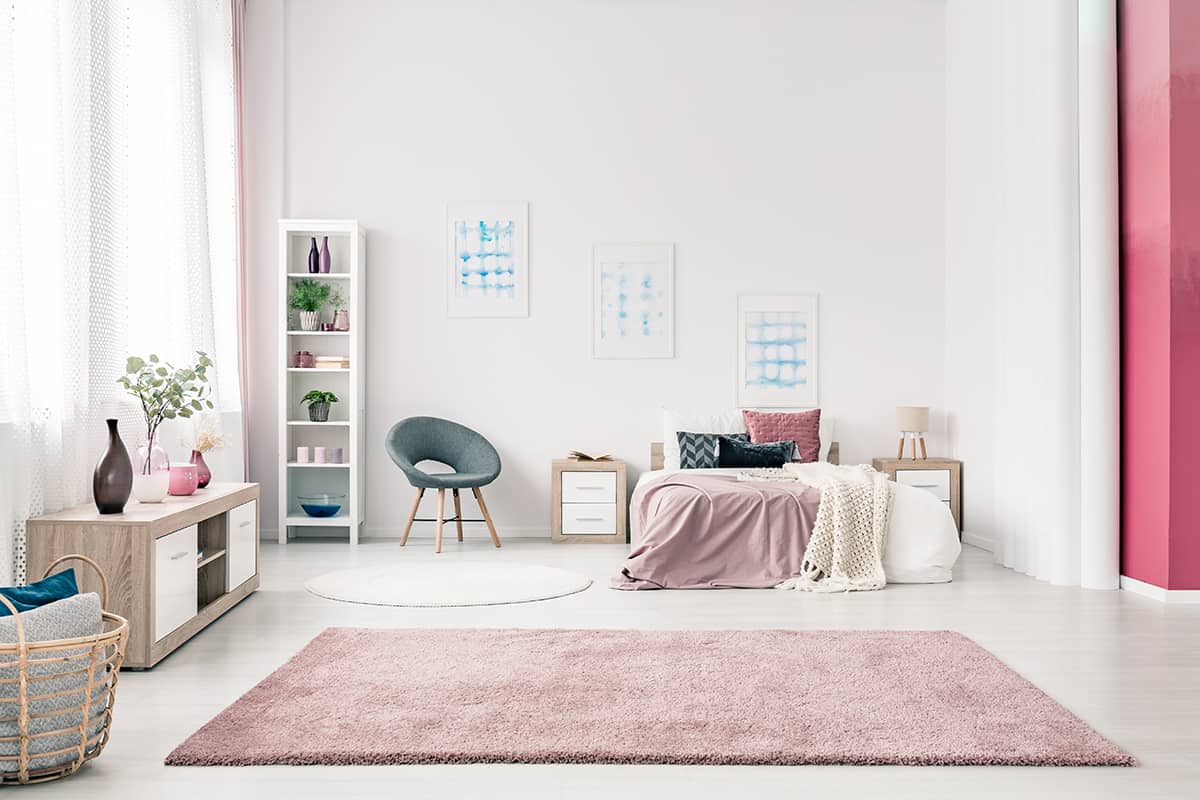 Pink Fluffy Rug with Brown Couch