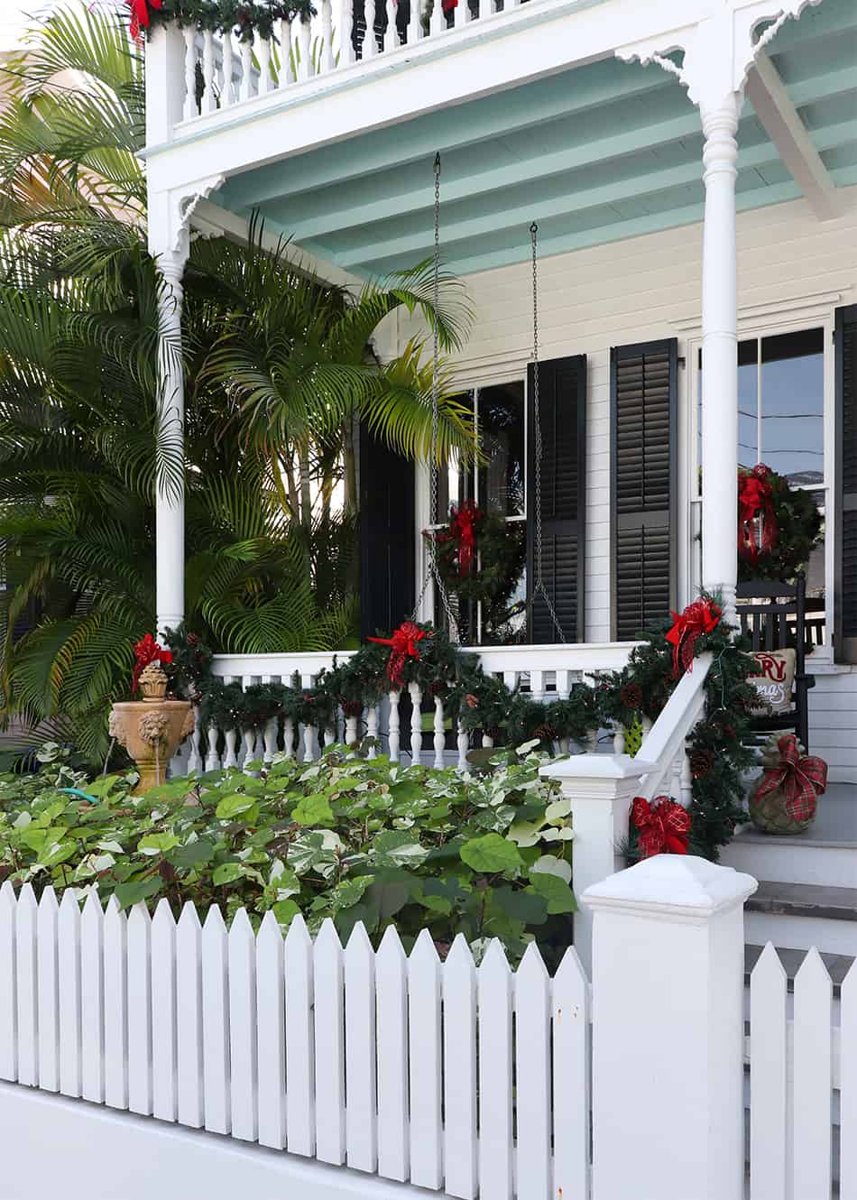 A Chic Colonial Home with White Porch Railings