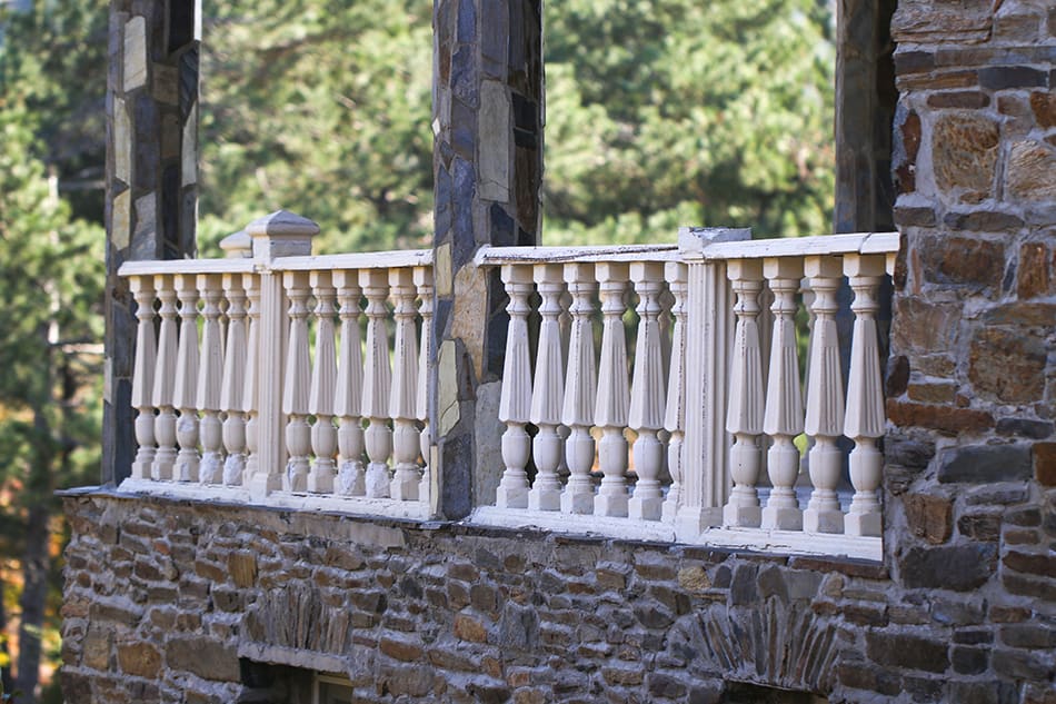 A Stone House with Turned Baluster Railings