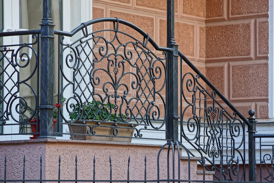 Bricked Porch with a Wrought Iron Railing