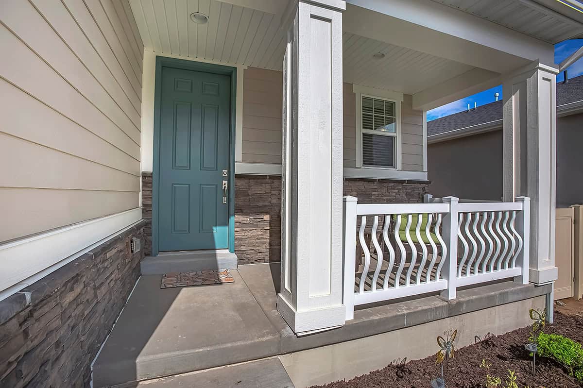 Modern Looking Porch with White Arched Baluster Railings