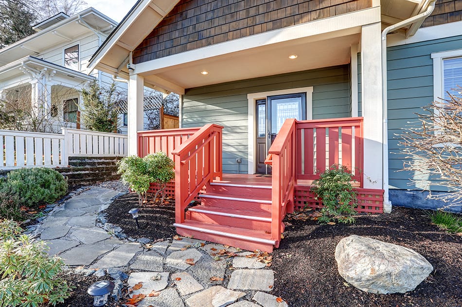 Traditional Home with Red Plank Railings