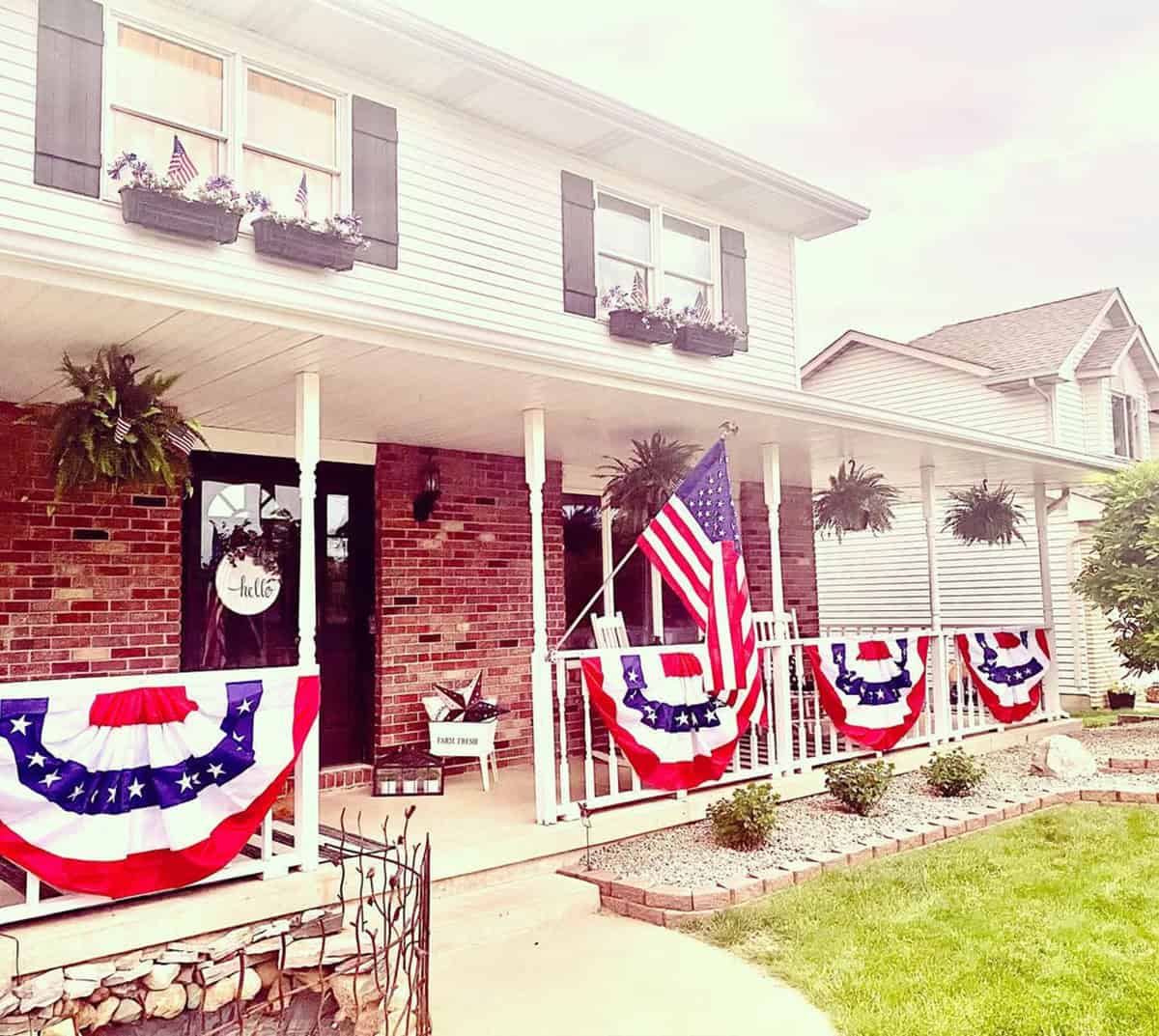 Traditional White Spindle Porch Railing with Patriotic Decor