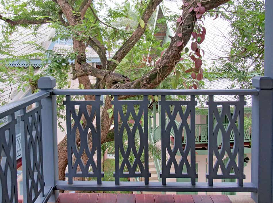 Wooden Porch Railing with Geometric Patterns