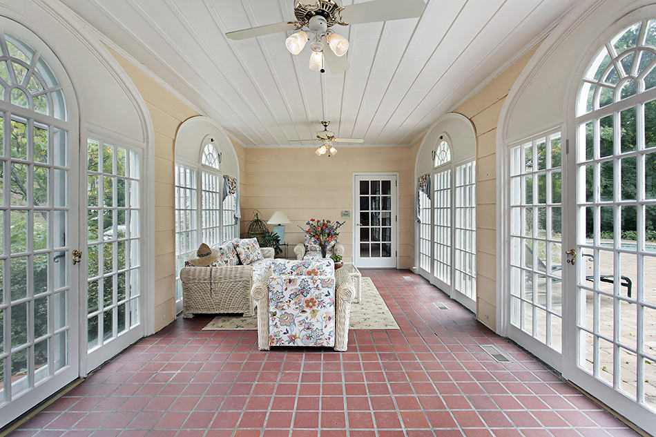 Breezeway Porch with Arched Doors and Red Brick Tile