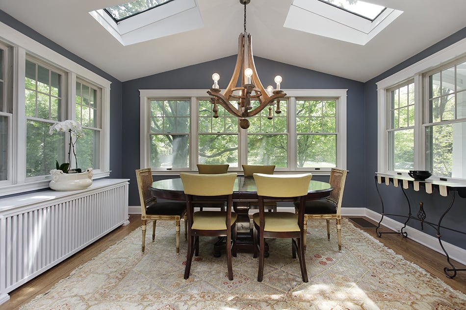 Dining Room with Wood Floor and Skylights