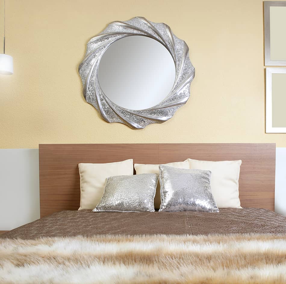 Hang a Stylish Mirror Above the Bed