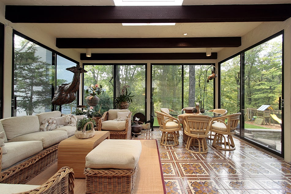 Sun Room with Rug and Patterned Tile Floor