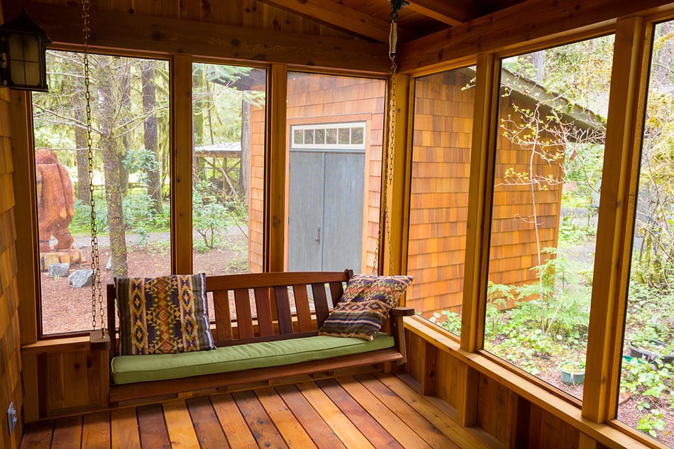 Wood Plank Porch with Bench Swing