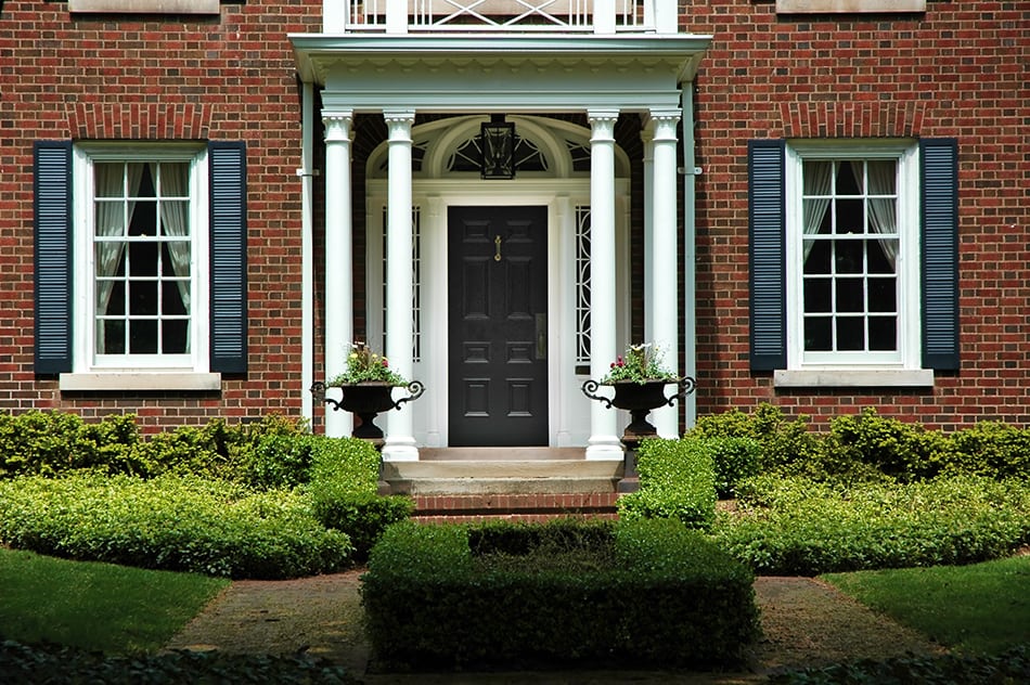 Black Door with Blue Shutters