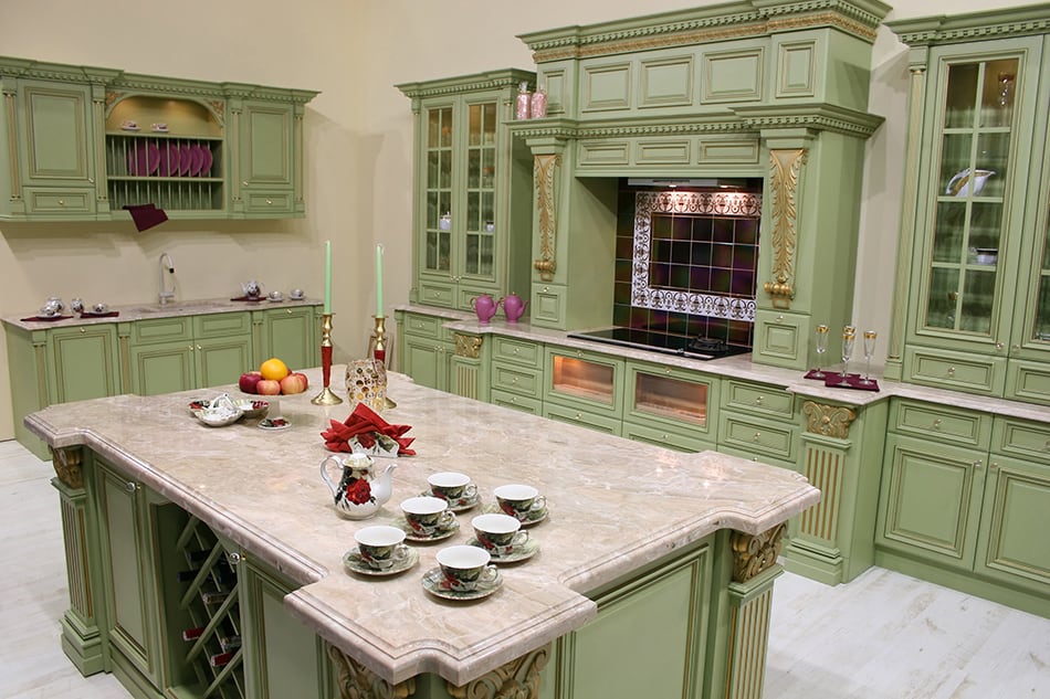 Sage green wooden cabinets