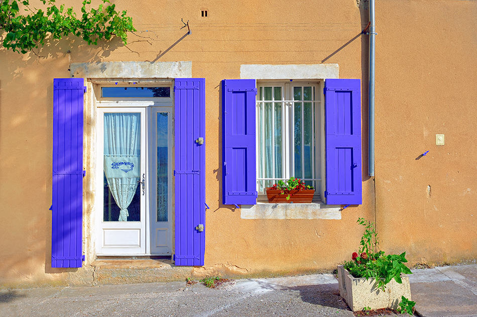 White Door with Purple Shutters