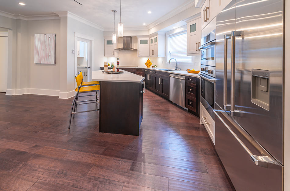 Black wooden cabinets with yellow stools