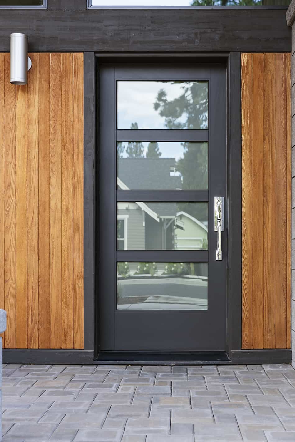 Black Door on Modern Brown House