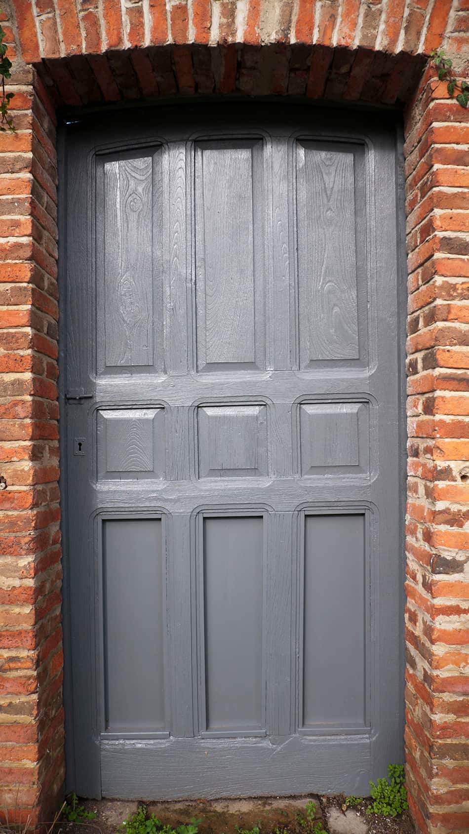 Bluish Gray Door on Brown Brick Exterior