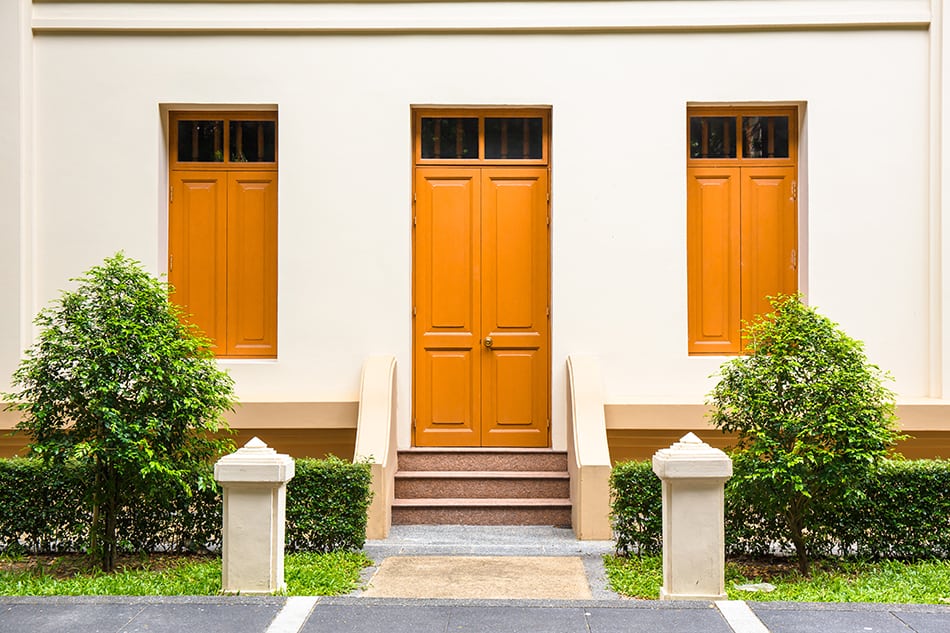 Bold Orange Front Door and Tan House