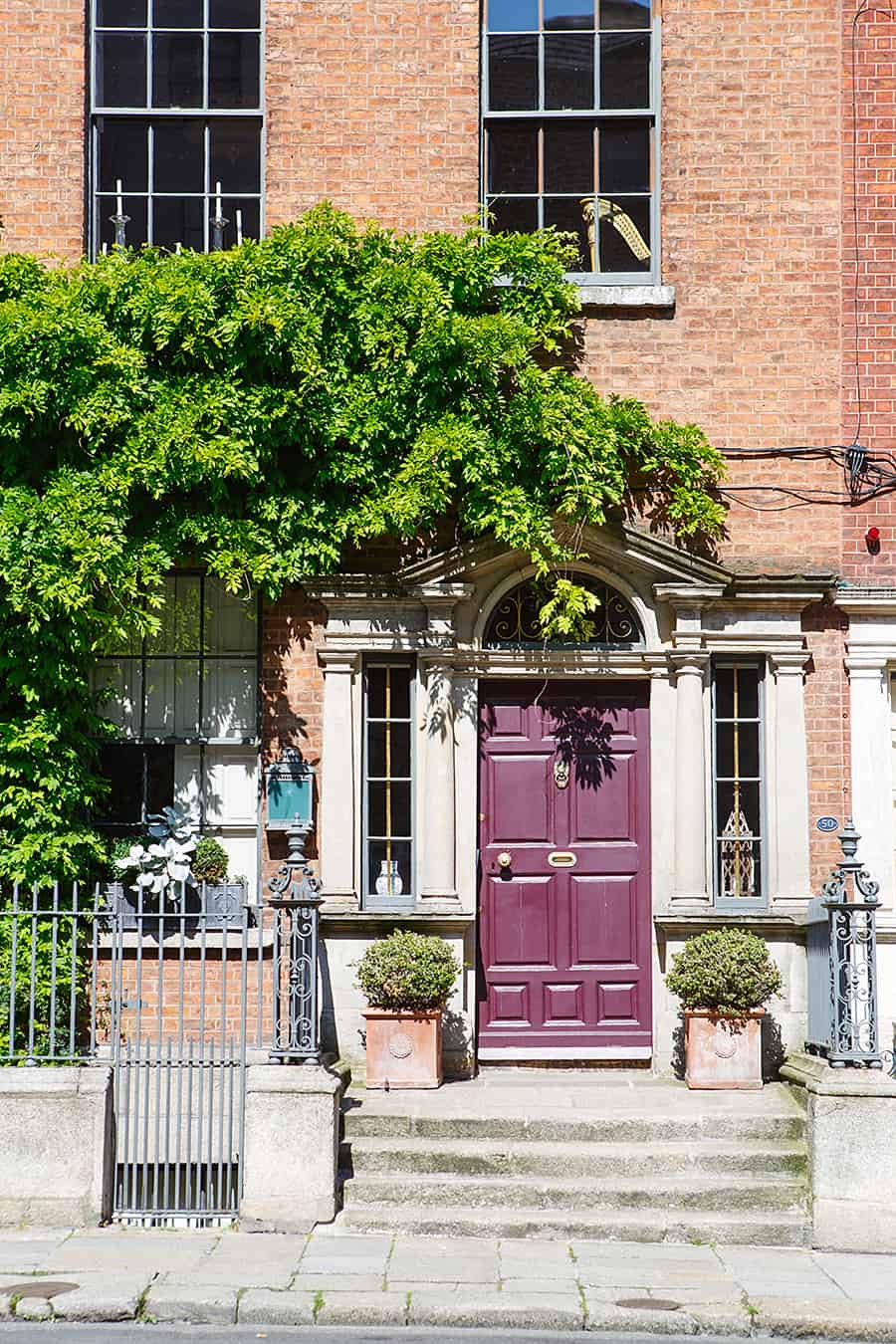 Burgundy Front Door and Red Brick House