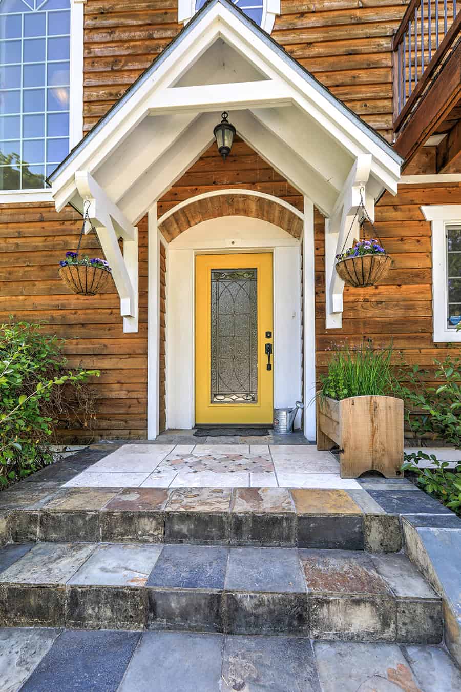 Yellow Front Door on Brown Wooden House