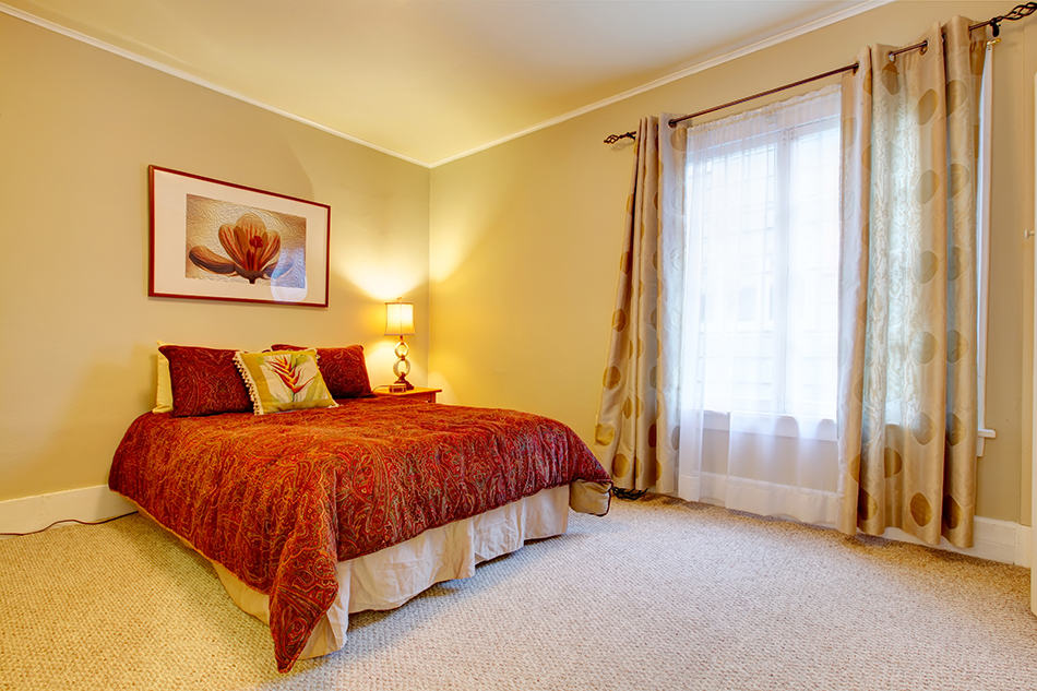 Sheer Beige Curtain With Muted Yellow Walls