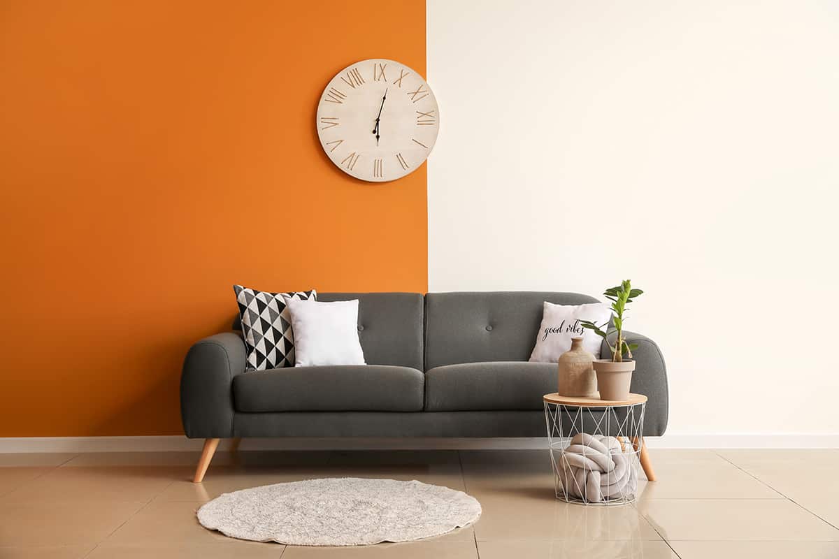 Pair the Charcoal Gray Couch with Orange Wall
