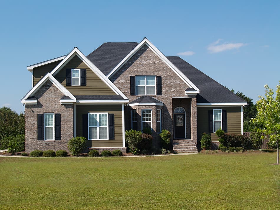 Brown house with a black roof